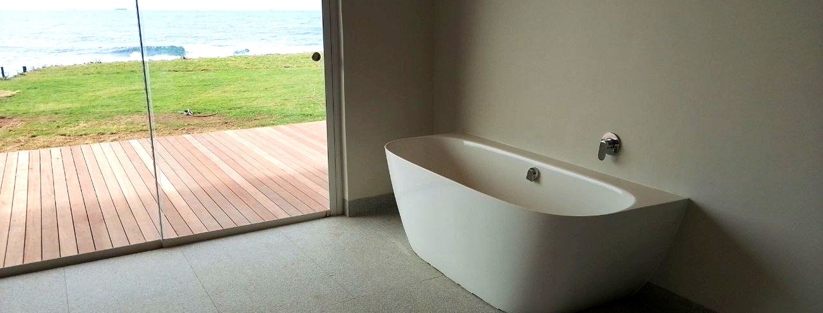 Premium bathroom with ocean view — Dudley's Plumbers